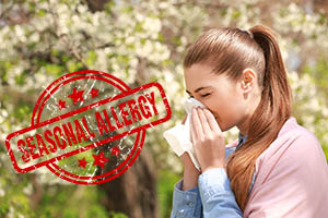 Girl suffering from allergies from contaminated air in home without a whole house air purifier