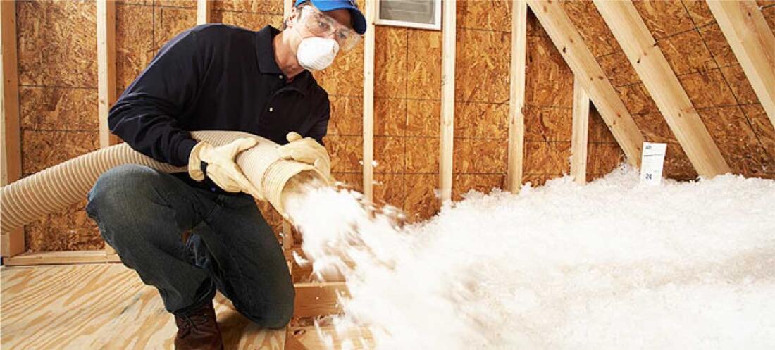 Extreme Comfort Man blowing attic insulation into a home, attic insulation discount special