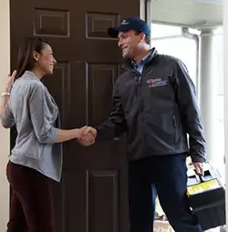 Extreme Comfort Air Conditioning & Heating Service Technician greeting customer