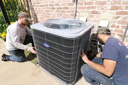 HVAC technicians installing new AC system after old system failed in Texas heat