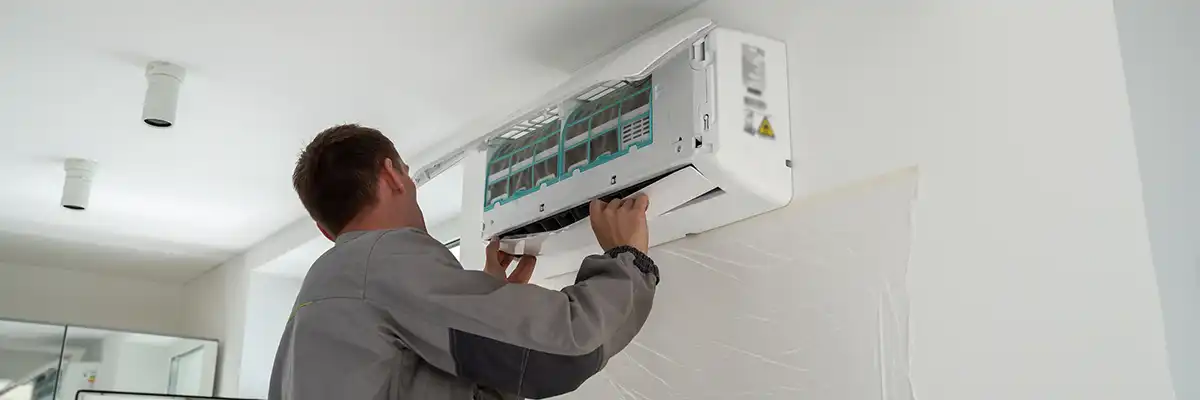 Trane ductless mini split installation Extreme Comfort HVAC technician installing Trane ductless mini-split ac system in home.