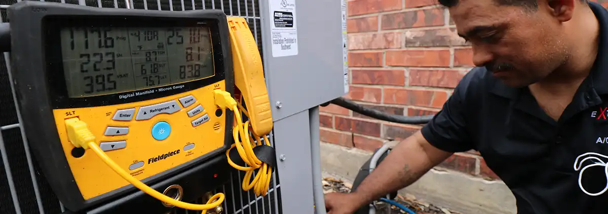 AC Repair technician checking coolant levels in Dallas